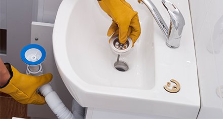 First Choice Water and Plumbing clearing a clogged sink